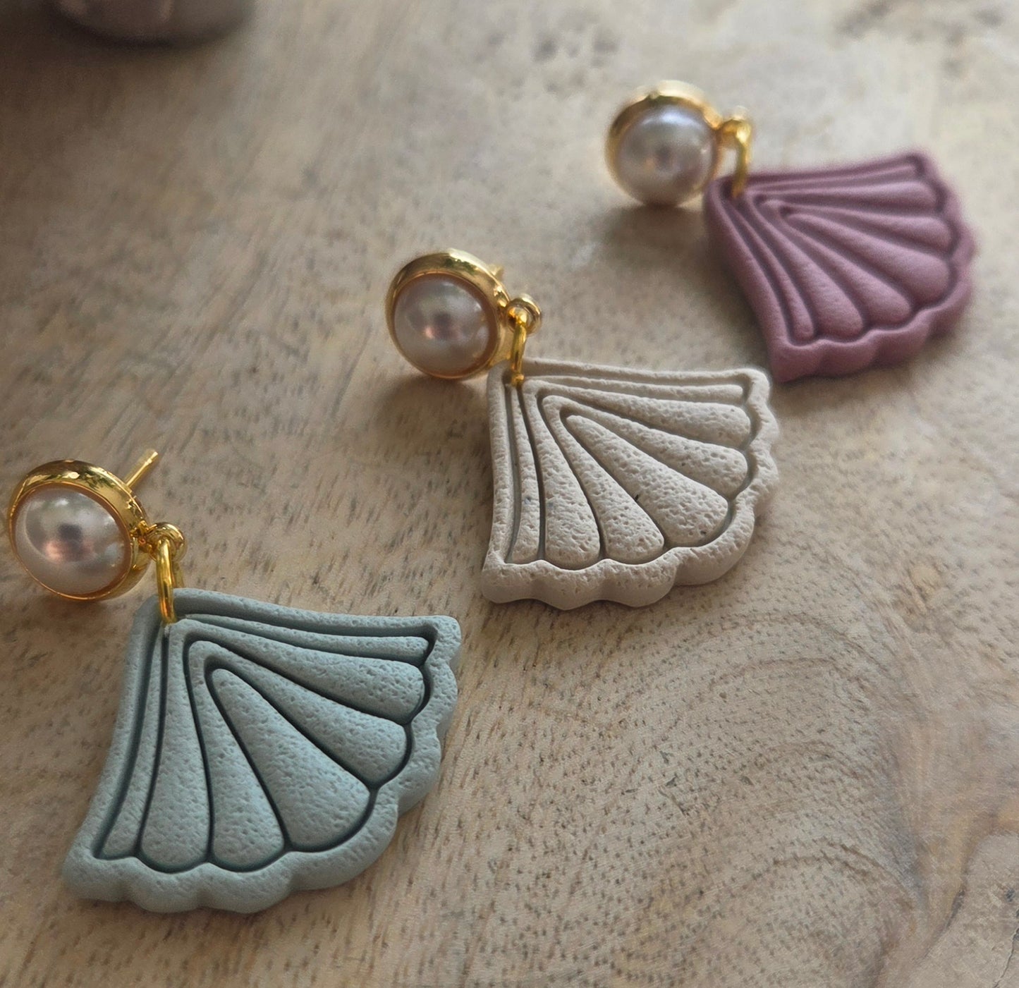 Boho Fans on a pearl stud.
