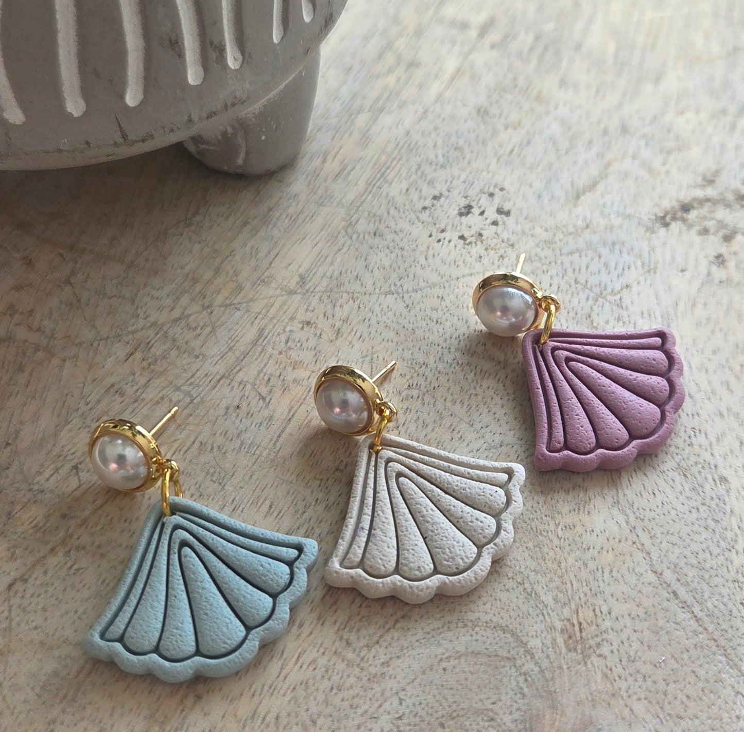 Boho Fans on a pearl stud.